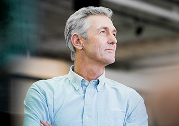 Mature advisor looking off into the distance